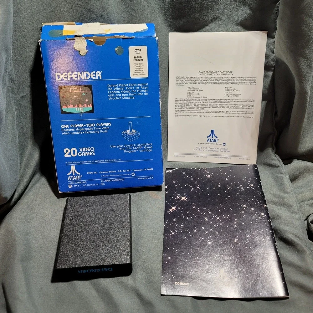 Defender‎ Atari CX2609, 1982 Complete with manual and DC Atari Force Mini Comic